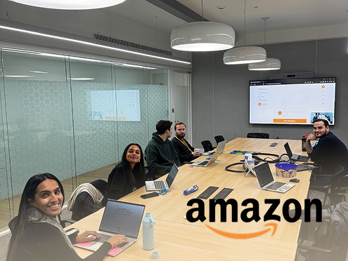 hoto of Amazon team in workshop session, capturing moments of alignment and growth during the team development workshop.